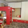 Dormitorio juvenil con litera, nido, armario y mesa de estudio - Image 2